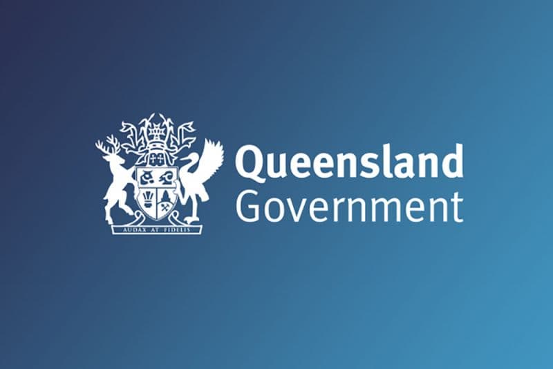 White Queensland Government logo and coat of arms on a blue gradient background.